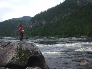 Seeking the Current filmmaker Nicolas Boisclair on the banks of the Romaine River, site of Hydro-Québec's $8 billion Romaine project (photo used by permission, Chercher le Courant)