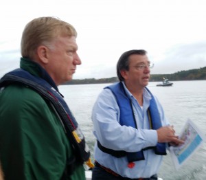Coordinator Carroll Brown explaining the boom deployment exercise to Assistant NH DES Commissioner Clark Freise
