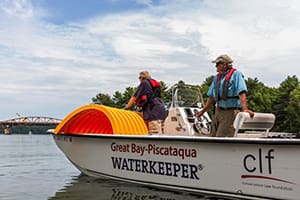 CLF Great Bay–Piscataqua Waterkeeper Jeff Barnum and unidentified debris. Photo: EcoPhography