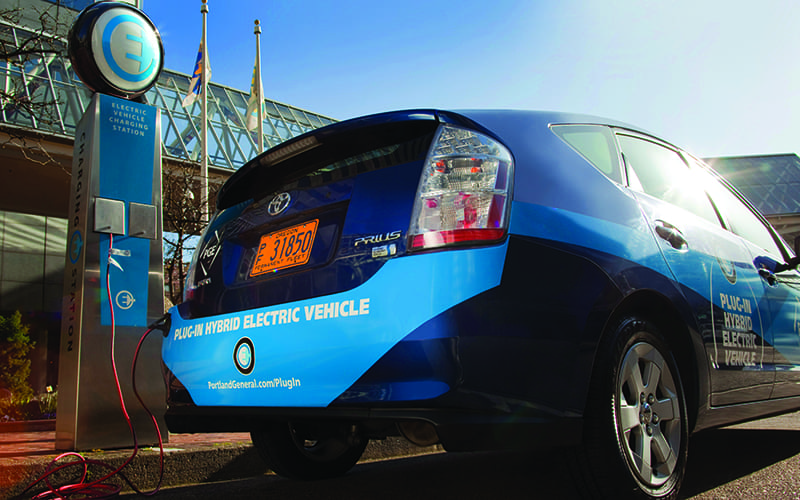 Photo: Electric Vehicle & Charging Station via CC 2.0