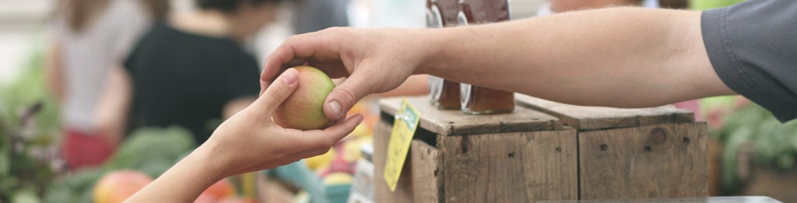 Photo of hand with apple