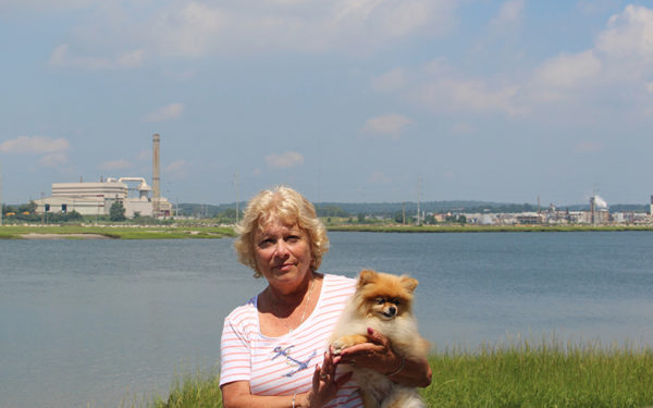 Photo: Doreen Weinberg stands across from the Wheelabrator Landfill in Saugus