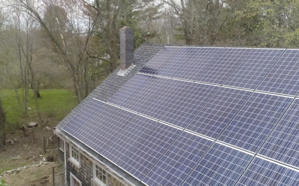 Rooftop solar panels on a barn in Maine
