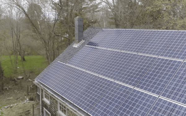 Rooftop solar panels on a barn in Maine