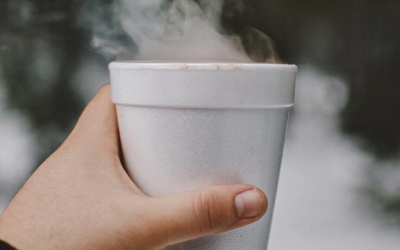 steaming foam cup of hot beverage