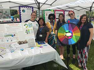 Resident researchers at their table during the YMCA Kick-Off event