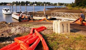 New Hampshire’s Oil Spill Response team on the job replacing floating booms used to contain spills.