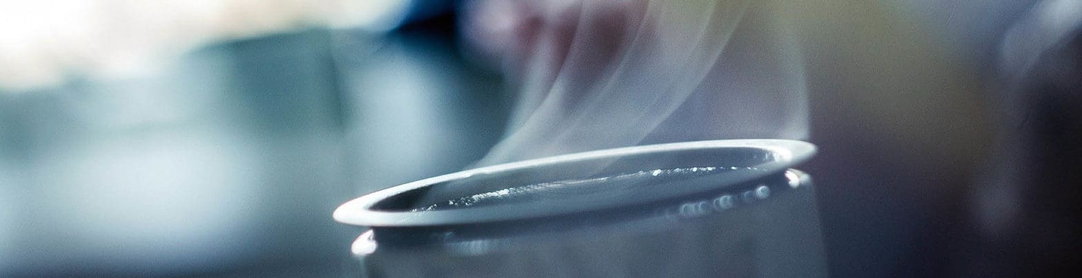 Hot steaming cup of coffee