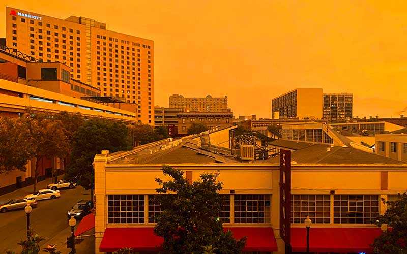 Wildfires across the West Coast turned the sky in Oakland, CA an eerie orange yellow