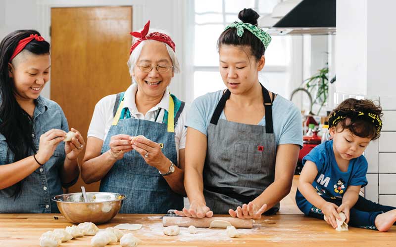 Mei and Irene Li cooking with family