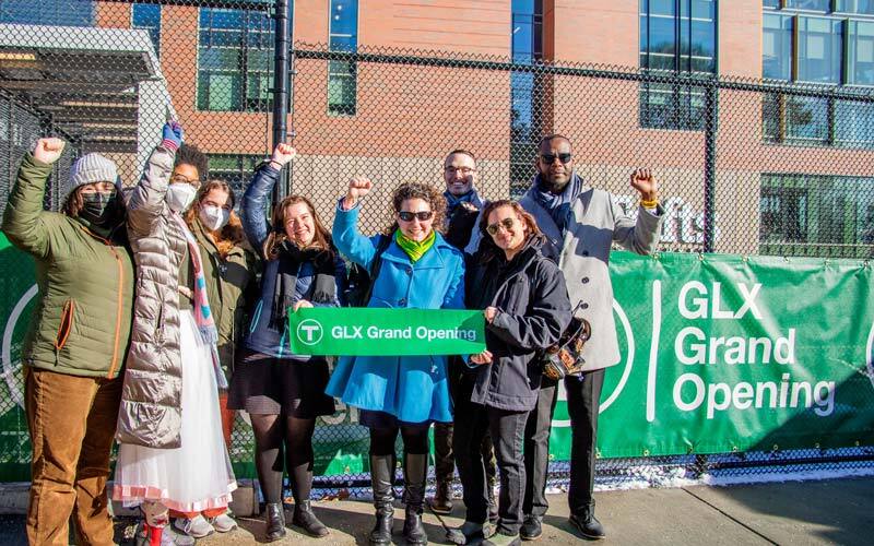 CLF staff celebrate outside the new Medford/Tufts Green Line extension station.