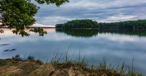 Great Bay, New Hampshire with overcast skies. View of greenery in Durham Point on the background. Area of annual Great Bay cleanup.