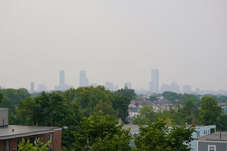 A hazy Boston skyline as a result of raging wildfires in Canada is a sign of the impacts of climate change.