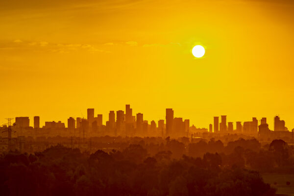 View of a city skyline in the summer heat