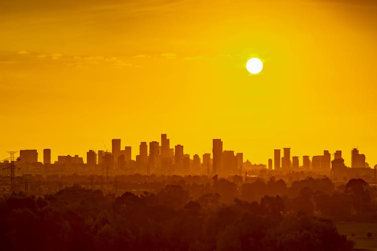 View of a city skyline in the summer heat