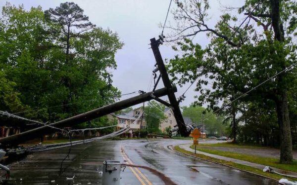 A downed power line in a road after a storm