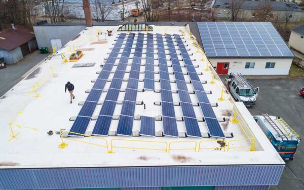 Large installation of solar panels on the roof of an industrial building