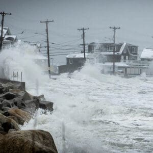 Storm wave breaking over sea wall