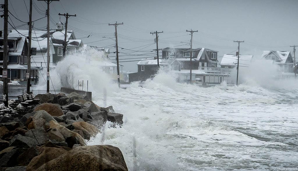 Storm wave breaking over sea wall
