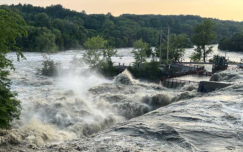 Flood waters rage over the Winooski Dam in Vermont