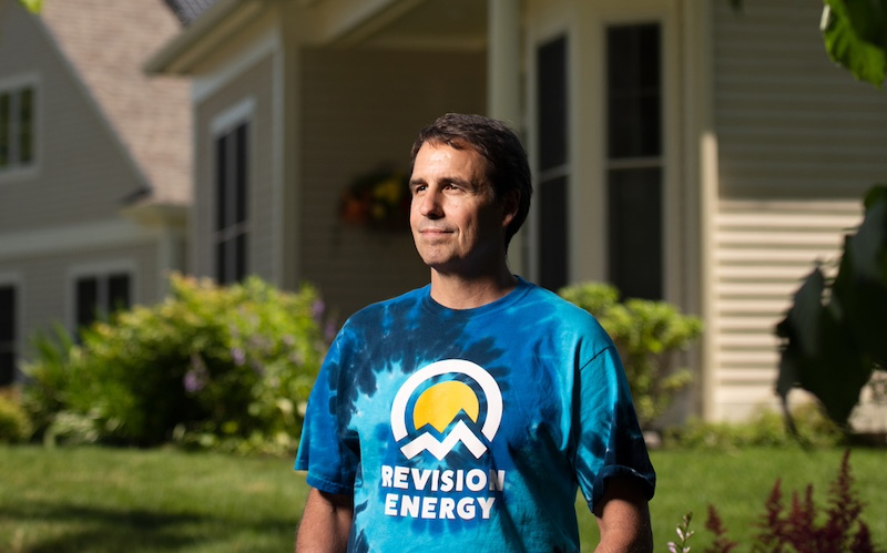 Photo of Phil Coupe, white male, standing before a home.