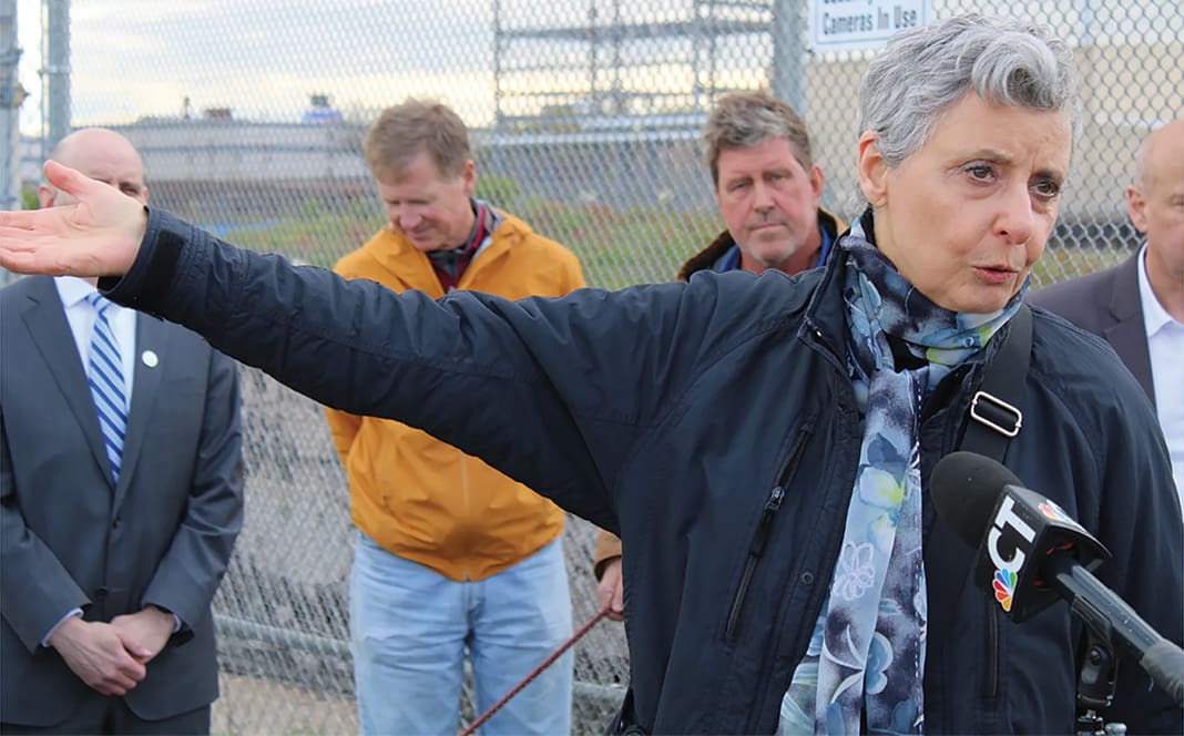 Woman speaking into a microphone