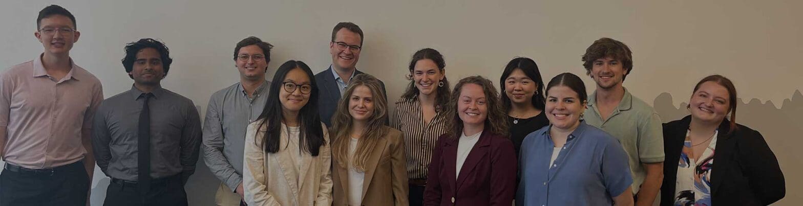 A group of people stand together