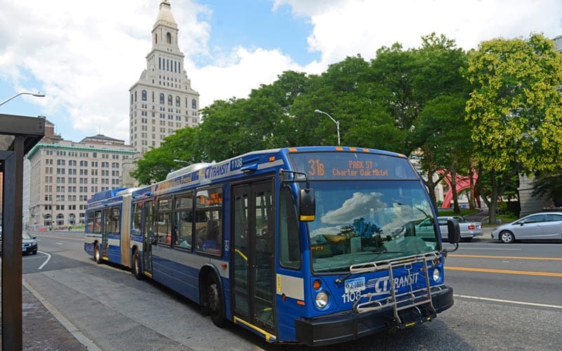 CTtransit bus in downtown Hartford, supporting fare-free transit for students.