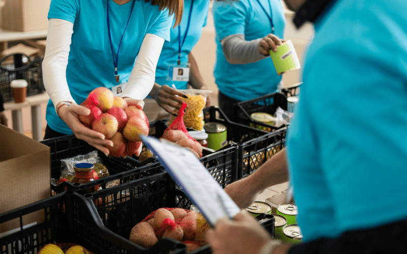 Volunteers packing food for donation