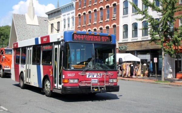 A Pioneer Valley Transit Authority Bus waits at Hampshire Plaza to pick up passengers.