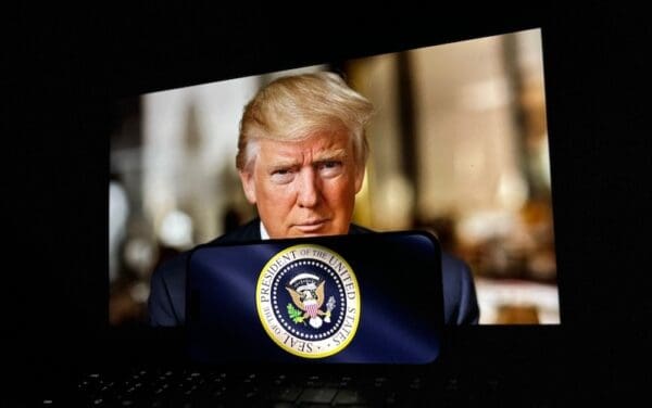 U.S. President Donald Trump on a laptop screen