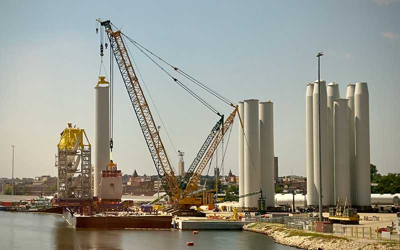 A port area shows offshore wind infrastructure
