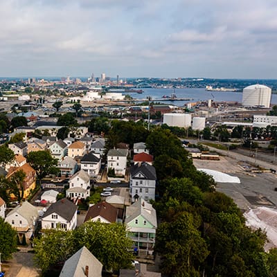 Aerial view of South Providence homes situated next to the industrial Port of Providence in Rhode Island.