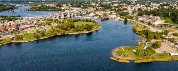 Aerial view of the Port of Providence in Rhode Island, where industrial facilities sit near neighborhoods and green spaces, highlighting local environmental justice issues.