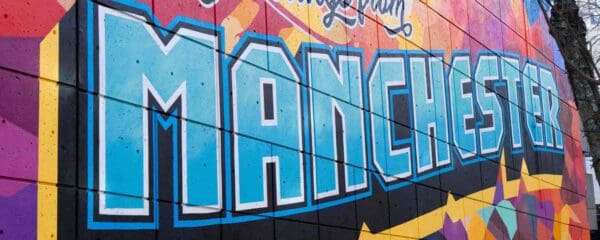 Colorful mural in Manchester, New Hampshire, reflecting community resilience amid the fight against PFAS pollution.